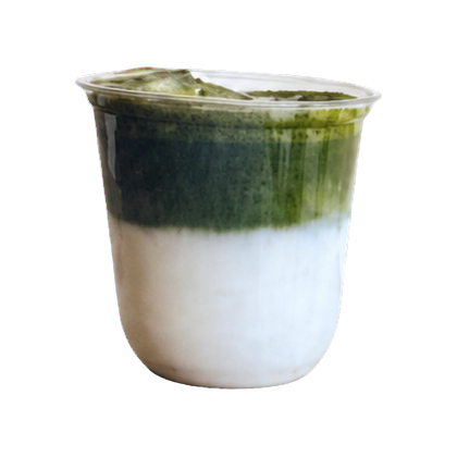 Iced specialty matcha latte with a deep green band above milk